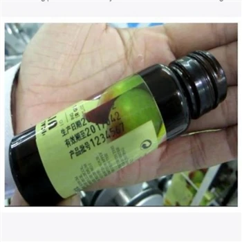 Etiquetadora manual de botellas con impresora de fecha