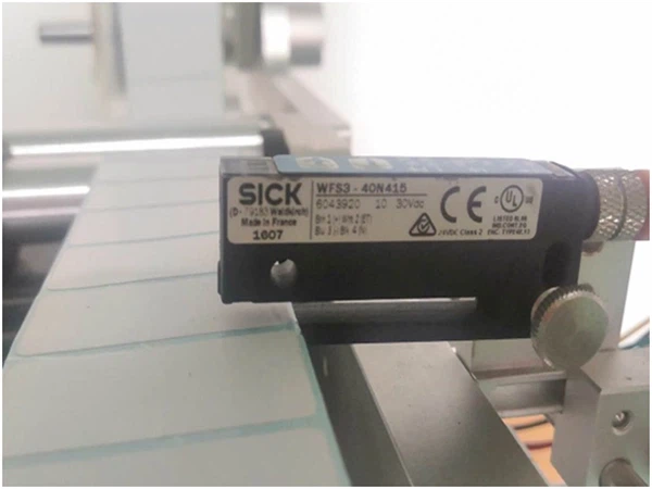 Problema del ojo del sensor y solución de la máquina de etiquetado.